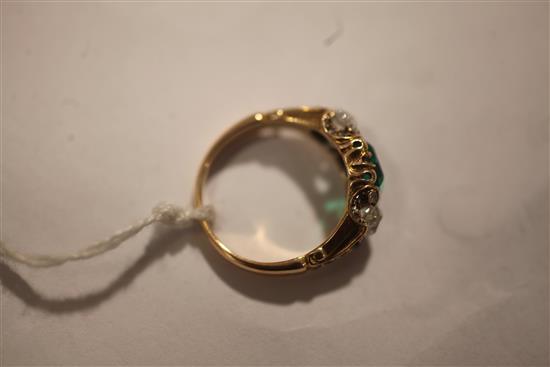 A 19th century gold, single stone emerald and two stone diamond ring, size M/N